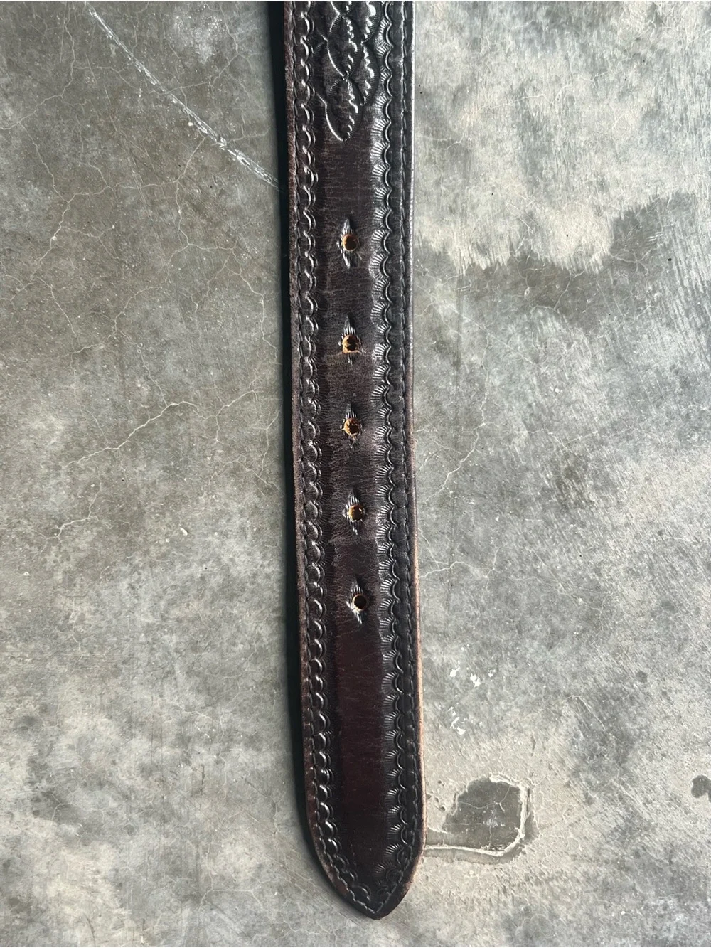 Vintage Levi's black tooled leather western belt with rotating harness buckle